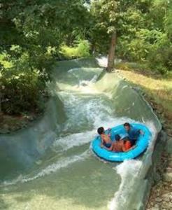 two people in a blue raft in a river at Appalachian TOP 4TH FLOOR Studio plus amazing views in Vernon Township +31 photos