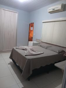 a bedroom with a bed in a room at Restaurante e Hotel Campos in Nova Andradina