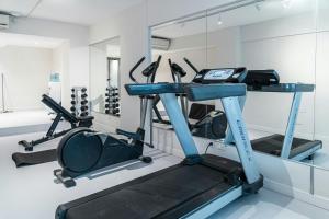 a gym with a treadmill and a mirror at City Express Plus by Marriott Buenos Aires Palermo in Buenos Aires