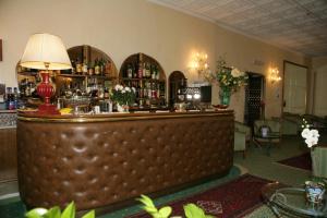 The lounge or bar area at Hotel Diana