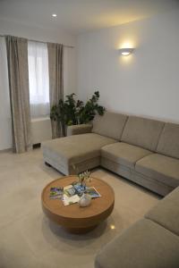 a living room with a couch and a coffee table at Pax et Bonum in Lozovac