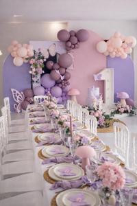 a long table in a room with plates and flowers at Villa luxueuse Piscine Chauffée & SPA in Villetelle +30 photos