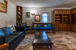 a living room with couches and a coffee table at Gkr Luxury Villa in Aghia Marina