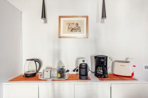 a kitchen counter with many appliances on it at ARONA STORICO SYC Favoloso 2CAMERE 2BAGNI in Arona