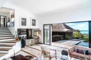 a living room with a view of the ocean at Villa Baki - Luxe & Ocean View in Le Morne