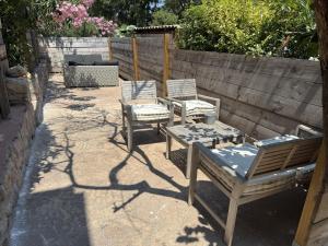 a group of chairs sitting on a patio at Chambres d'Hôtes Terra Bella in Lecci