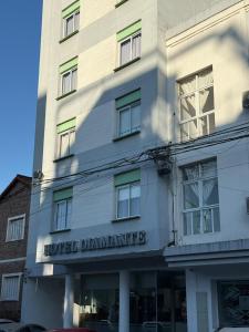 a white building with the words hotel dermatant on it at HOTEL DIAMANTE in Resistencia