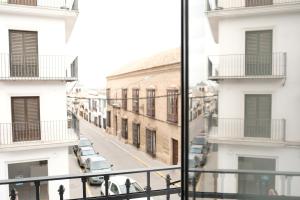 a view of a city street from a balcony at Balcones a San Pedro in Osuna +7 photos
