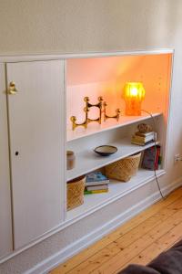 a cabinet with a sink and a lamp in a room at Goldlöckchen, 80 qm 2-Room Apartment im Herzen der Detmolder Innenstadt in Detmold +32 photos