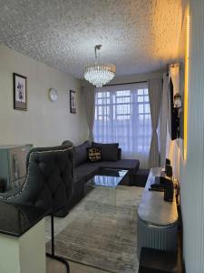 a living room with a couch and a table at Silvia Homes Nanyuki in Nanyuki