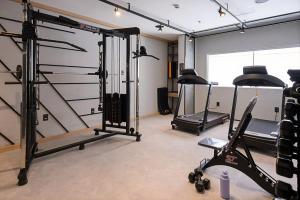 a gym with several tread machines in a room at Ibis Caruaru in Caruaru