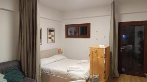 a small bedroom with a bed and a window at RC vacanze interno 57 in Rocca di Mezzo +8 photos