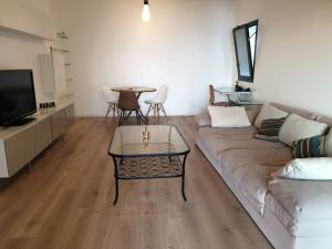 a living room with a couch and a table at Ajaccio Sanguinaires in Ajaccio +15 photos