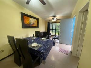 a dining room with a table with a blue table cloth at La Casita Azul in Orizaba