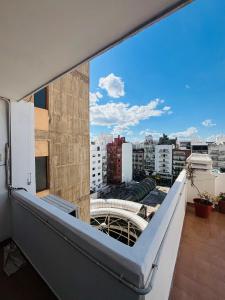 a balcony with a view of a city at Departamento La Merced in Córdoba
