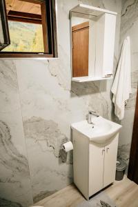 a bathroom with a sink and a mirror at Mountain rest Brezna in Plužine +14 photos