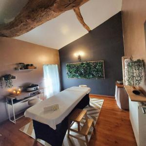 a kitchen with a white table in a room at Moulin de Monpoisson in Le Puy +62 photos