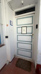 a garage door with a clock on top of it at Apartamento Biembe in Chinchón