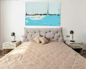 a bedroom with a large bed with two tables at Deluxe Room! in Lucan