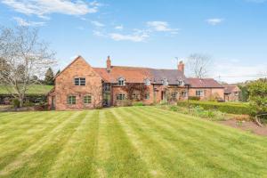a large brick house with a large grass yard at 4 Bed in Shrawley oc-s34861 in Shrawley