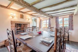 a dining room with a long table and chairs at 4 Bed in Shrawley oc-s34861 in Shrawley
