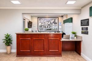 a lobby with a reception desk in a waiting room at Super 8 by Wyndham Barstow in Barstow +27 photos