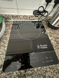 a close up of a russell hobbs electronic device at Abu Dhabi City Private Room Late Check out 2pm in Abu Dhabi