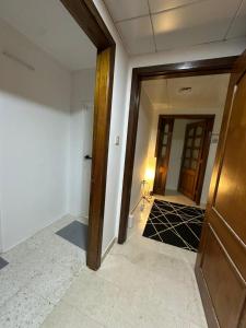 an empty room with a door and a hallway at Abu Dhabi City Private Room Late Check out 2pm in Abu Dhabi