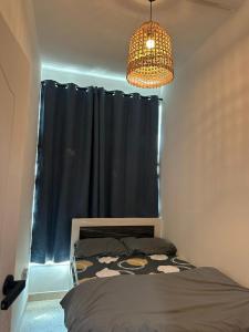 a bedroom with a bed and a black curtain at Abu Dhabi City Private Room Late Check out 2pm in Abu Dhabi +44 photos
