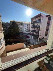 a window with a view of a building at ANKA apartman in Smederevo