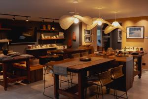 a room with tables and chairs in a store at Sui Boutique Hotel in Medellín