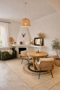 a living room with a table and chairs at Tenuta Maison Angelina in Formia
