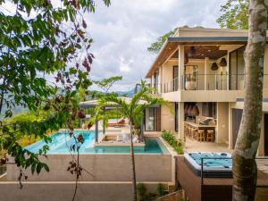 an image of a house with a swimming pool at Casa Riverstone in Dominical