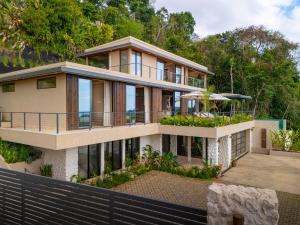 a house with a view of the ocean at Casa Riverstone in Dominical