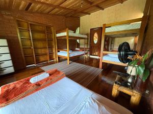 a bedroom with two bunk beds in a room at Wisdom Forest Lodge in Tena +66 photos