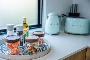 a tray with bottles of alcohol on a kitchen counter at The Shell Shack on Whisper Bay in Cannonvale