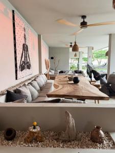 a living room with a couch and a table at Selvamar Hermosa in Playa Hermosa +22 photos
