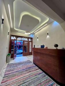 a lobby with a large rug on the floor at Saray Hotel Dahab in Dahab