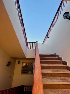 a stairway leading up to a building with stairs at Saray Hotel Dahab in Dahab