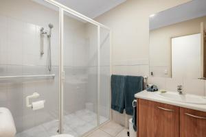 a bathroom with a shower and a sink at Bay Breeze in Cowes +6 photos