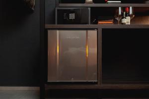 a microwave oven sitting on top of a shelf at Sui Boutique Hotel in Medellín