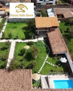 an aerial view of a yard with a swimming pool at Chaska Valle Green in Urubamba +82 photos