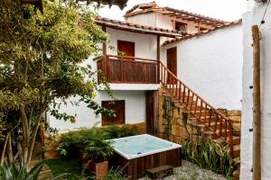 a house with a hot tub in the yard at Romantic Colonial Charm Barichara w Jacuzzi in Barichara
