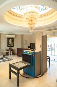 a room with a table and a chandelier at Nile Trans Hotel in Cairo