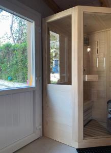 a glass door in a room with a window at Nadia's Beach House in Pefkari +25 photos