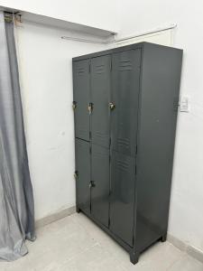 a locker room with black lockers in a room at Viví el mundo Boca en el HOSTEL DEL 10 in Buenos Aires