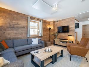 a living room with a couch and a table at Steier Hütte S in Donnersbachwald