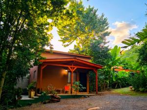 a small house in the middle of a forest at Minicasa Rural Maria Preta in Puerto Iguazú