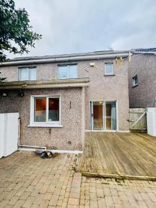 a brick house with a large courtyard in front of it at Duchess Victoria Haven in Drogheda