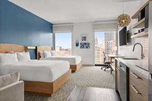 a hotel room with two beds and a kitchen at Element by Marriott New Orleans Downtown in New Orleans +87 photos